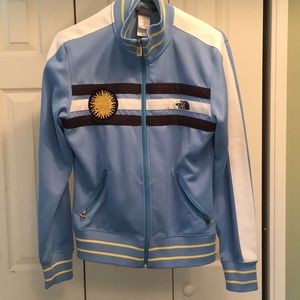 Women’s large North Face Zip up jacket.
